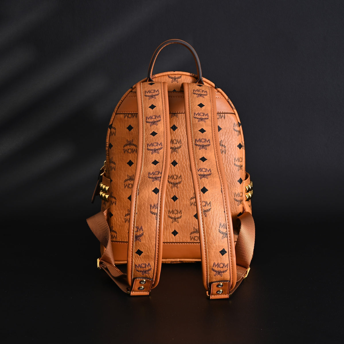 MCM Stark Visetos Medium Backpack – Cognac Monogram with Gold-Tone Studs