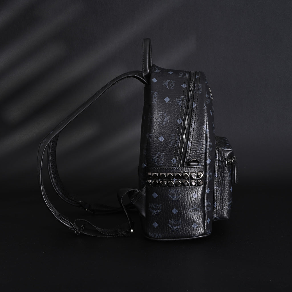 MCM Stark Visetos Medium Backpack – Black Monogram with Studded Detailing